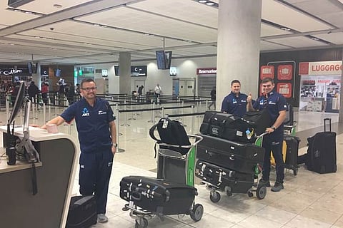 Mike Hesson and Tom Latham at Christchurch airport before leaving for India on Thursday