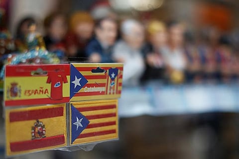 Patches depicting an Estelada (Catalan separatist flag) and a Spanish flag (L)