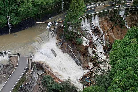 Typhoon Lan left a trail of destruction, with rivers bursting banks and landslides engulfing homes