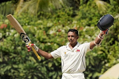 Prithvi Shaw raises his bat after scoring a century against Tamil Nadu on Tuesday