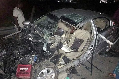The mangled remains of the car that collided with a lorry coming in the opposite direction on the NH