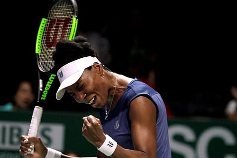 Venus Williams celebrates winning her group stage match against Garbine Muguruza