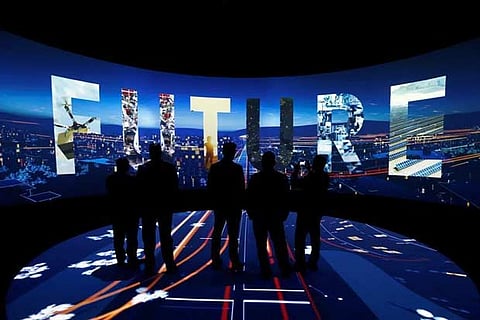 Visitors watch a 3D presentation during an exhibition on "Neom" in Riyadh