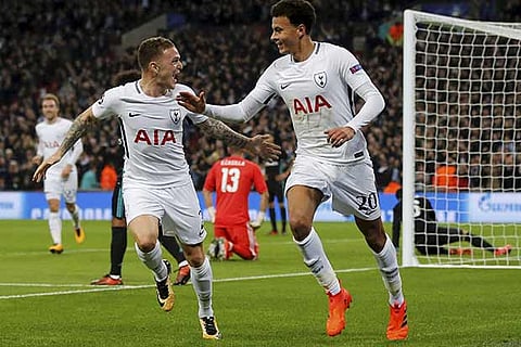 Dele Alli (right) exults with Kieran Trippier after scoring a goal against Real Madrid at Wembley