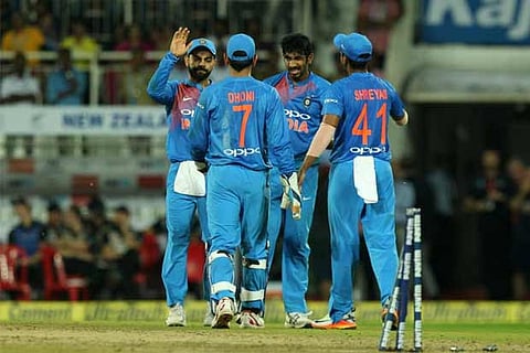 Skipper Virat Kohli celebrates with the team after beating New Zealand 2-1 to clinch the series