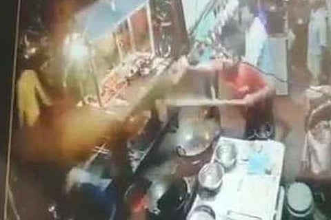 In the video, a group of men, including the customer, are also seen throwing things at the vendor