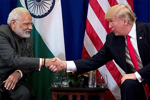 President Donald Trump and Indian Prime Minister Narendra Modi shake hands 