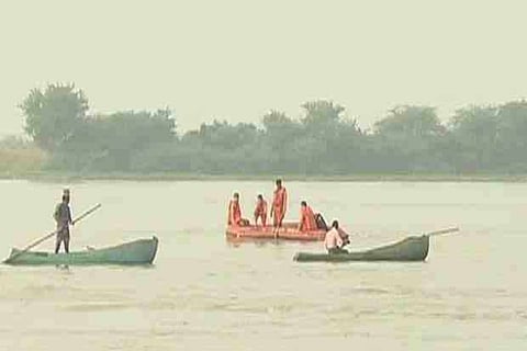 Boatsmen searching the surroundings for