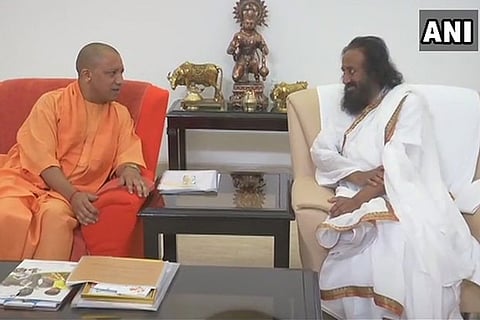 Uttar Pradesh Chief Minister Yogi Adityanath and Sri Sri Ravi Shankar