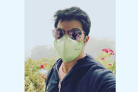 Varun Dhawan takes a selfie with a mask on his face denoting Delhi air pollution