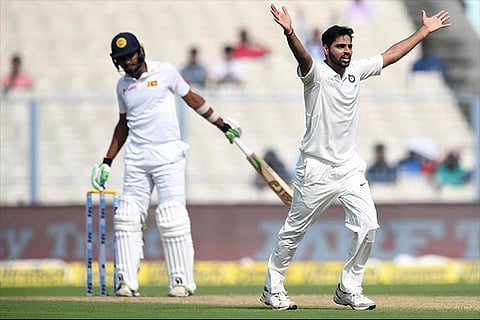 India's Bhuvneshwar Kumar (R) celebrates the wicket of Sri Lanka's Dasun Shanaka