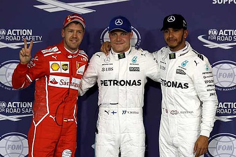 Lewis Hamilton(R), Valtteri Bottas (C) and Sebastian Vettel