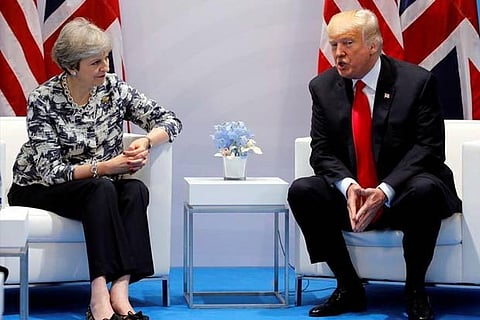 (File photo) UK PM Theresa May talks with US President Donald Trump during the G20 leaders summit