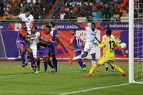 Chennaiyin FC skipper Henrique Sereno (second from left) heads the winner against FC Pune City