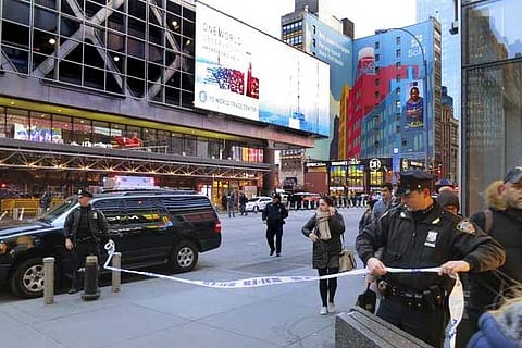 Police secure 8th Avenue outside the Port Authority Bus Terminal following an explosion near NY Time Square