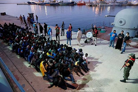 Migrants arrive at a naval base after they were rescued by Libyan Navy, in Tripoli