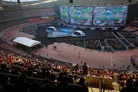 Spectators at a high stakes esports match being held at the Beijing National Stadium, China