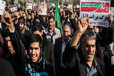 Protests hit Tehran, 2 demonstrators reported killed in Iran town