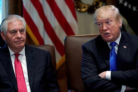 US President Donald Trump, flanked by Secretary of State Rex Tillerson