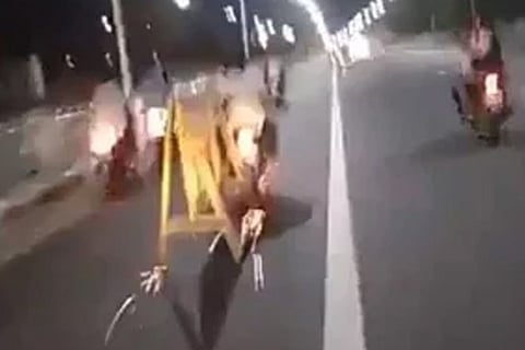 Bikers dragging a police barricade in Chennai