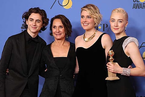 Greta Gerwig (2nd from R) and the cast of "Lady Bird" pose backstage