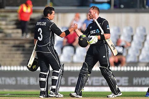 New Zealand?s Ross Taylor (left) and Martin Guptill celebrate its win against Pakistan