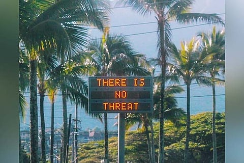 An electronic sign reads "There is no threat" in Oahu, Hawaii, US
