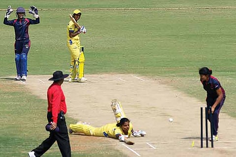 Tamil Nadu captain Niranjana Nagarajan makes a full length dive during the match