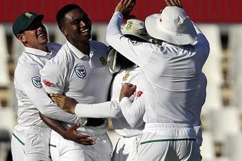 Lungi Ngidi celebrates with teammates after dismissing Virat Kohli