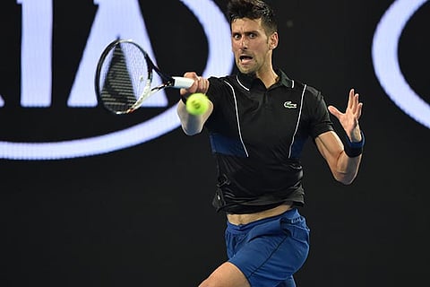 Djokovic downplays injury as he powers on