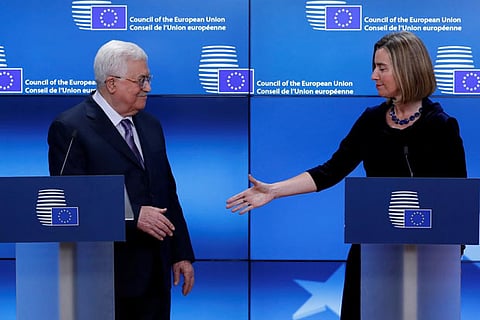 EU Representative for Foreign Affairs Mogherini shakes hands with Palestinian Prez Mahmoud Abbas (L)