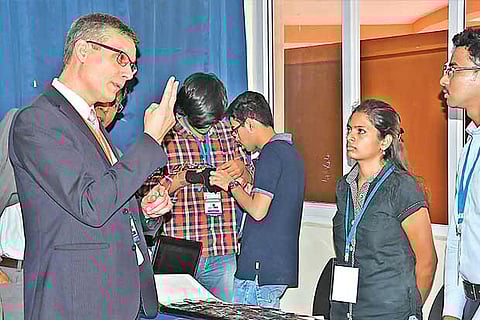 A French dignitary interacts with students at the hackathon held on Monday