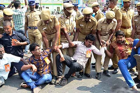 Police personnel forcefully evacuating the protesters in Madurai on Tuesday