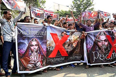 Activists of Rashtriya Rajput Karni Sena holding banners and raising slogans during a protest