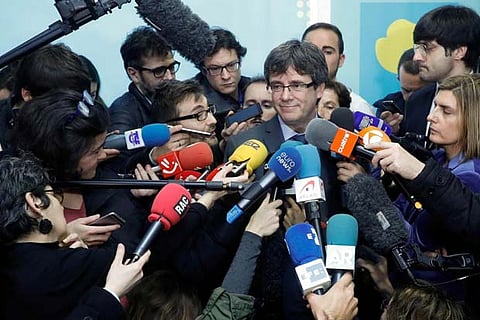 Former Catalan president Carles Puigdemont addresses the media