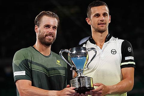 Oliver Marach and Mate Pavic celebrate with the trophy after winning the final