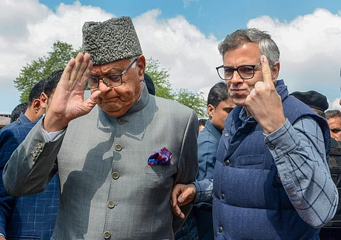 Srinagar NCP and Srinagar parliamentary candidate Farooq Abdullah with his son and former Chief Minister Omar Abdullah leave after casting vote (Pic: PTI)