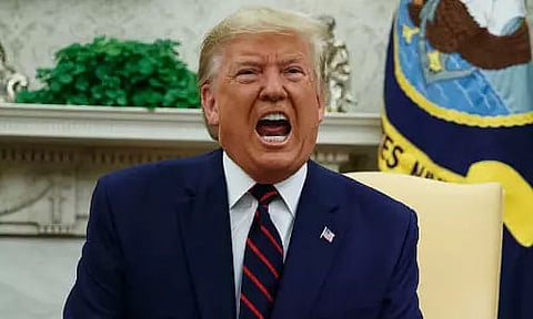 Twitter hides Trump's tweets for violating rules on glorification of violence