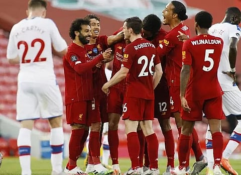 Liverpool move closer to title; United in top-four hunt