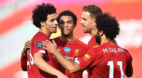 Champions Liverpool maintain 100 percent home record
