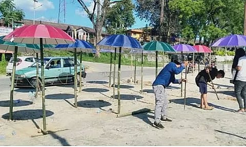 Bongaigaon's market uses Umbrellas to ensure social distancing