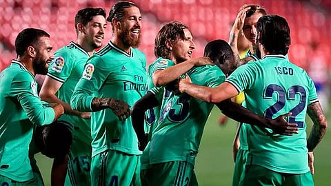 Real Madrid claim narrow win to move closer to league title