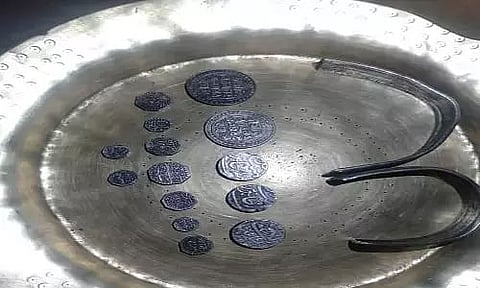Ahom era silver coins with a silver bangle found in North Assam