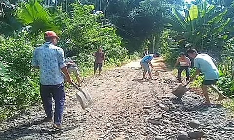 Villagers of Jagun Fulbari village repair road themselves
