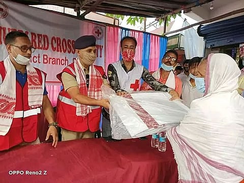 100 tarpaulins distributed among homeless people by Dhubri Red Cross Society