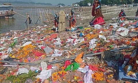 Kali idols lying on banks of Brahmaputra with filth, and dirt