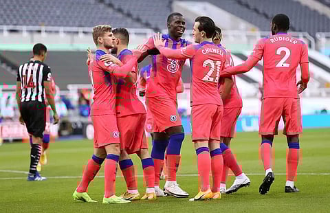 Chelsea go top with win at Newcastle
