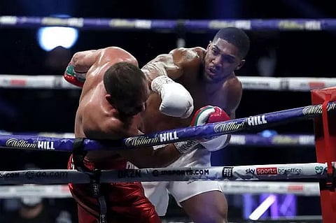 Anthony Joshua KOs Kubrat Pulev to retain heavyweight titles