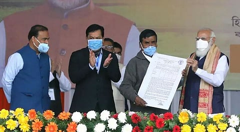 Narendra Modi distributes land-allotment certificates to indigenous beneficiaries