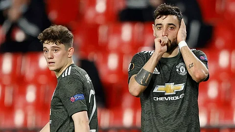 Manchester United put one foot in Europa semis; Arsenal held